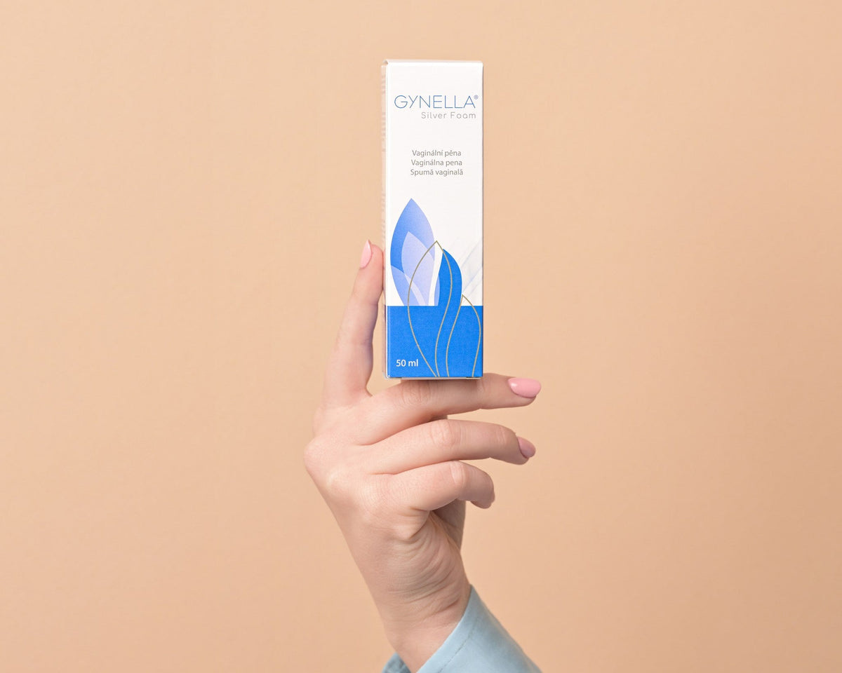 Pregnant woman holding Gynella Silver Foam box