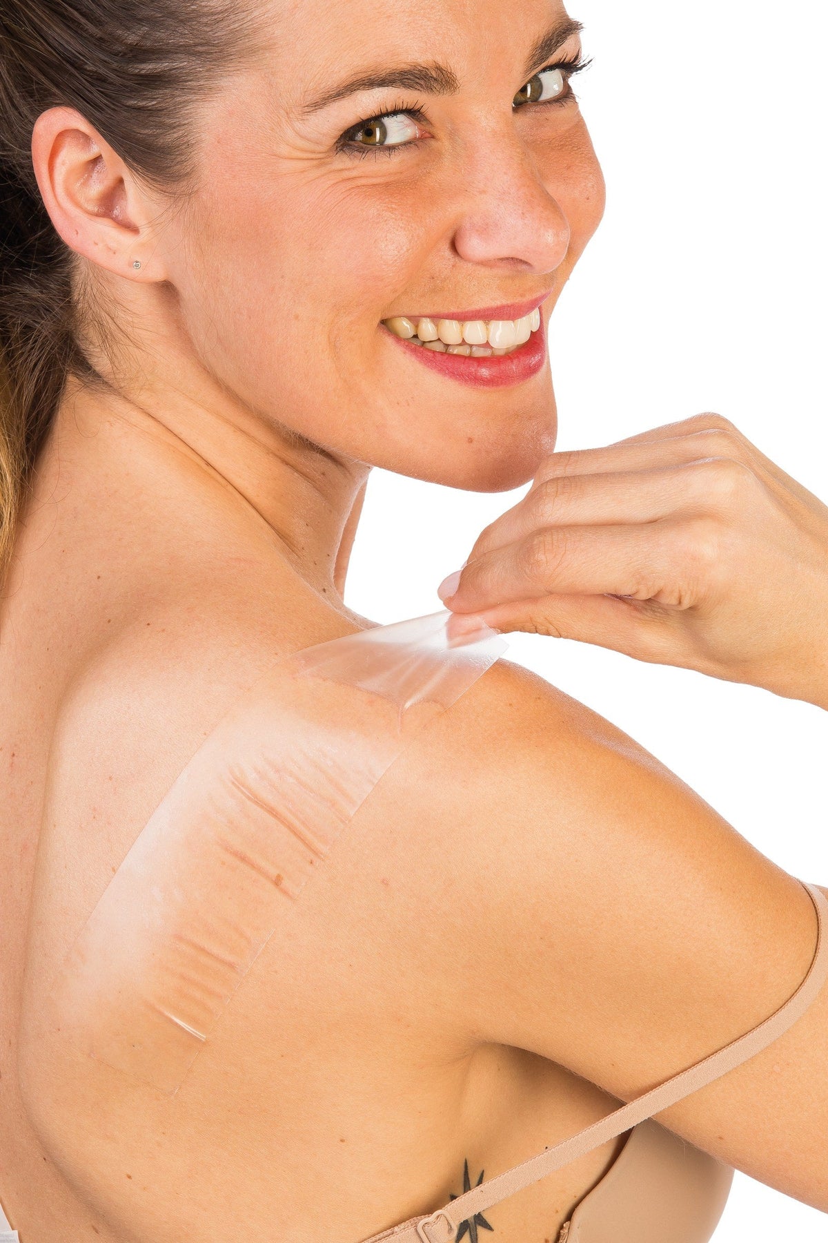 Cerederm dressing being peeled off a shoulder scar